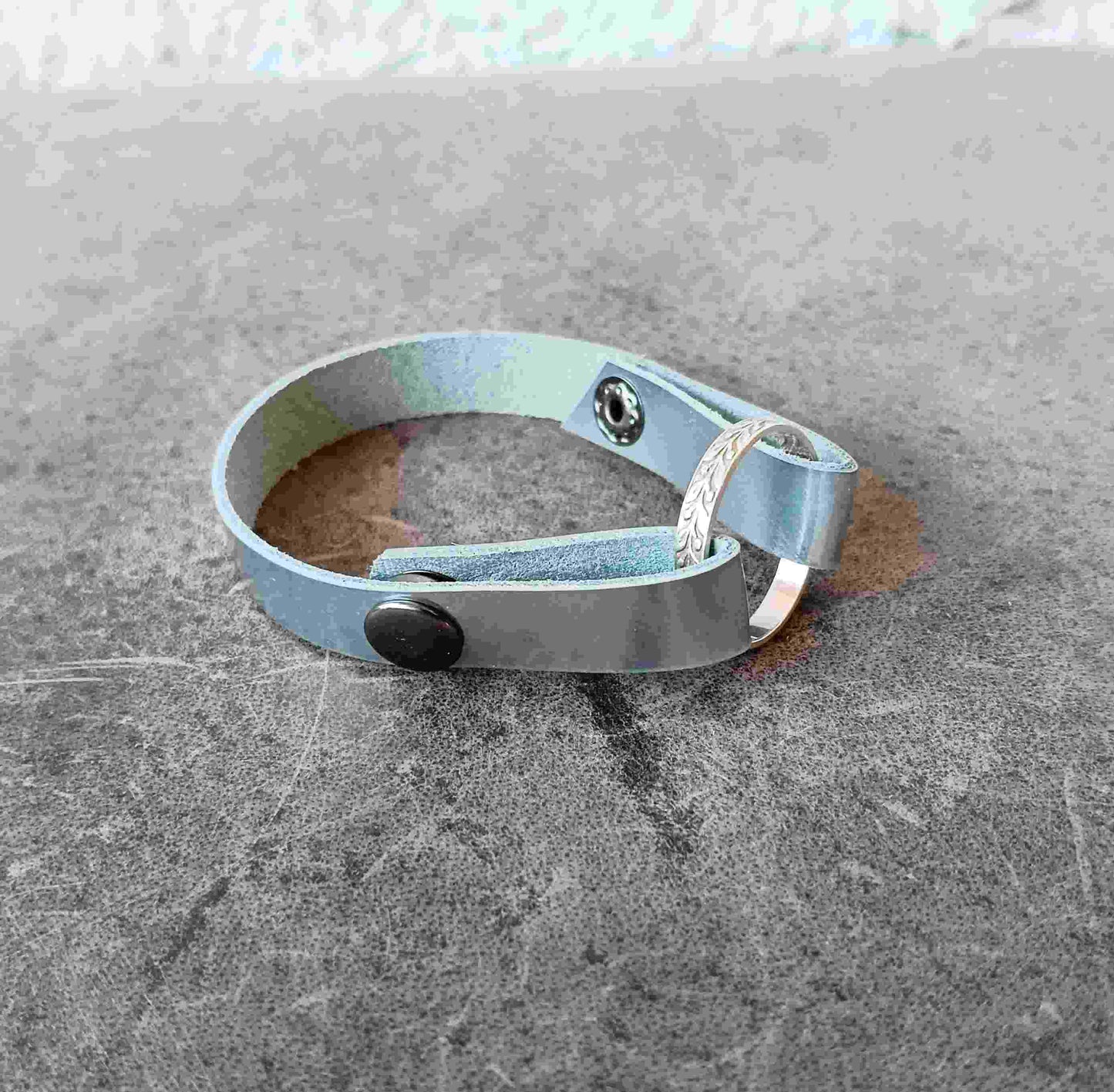 silver ringholder bracelet above angle view