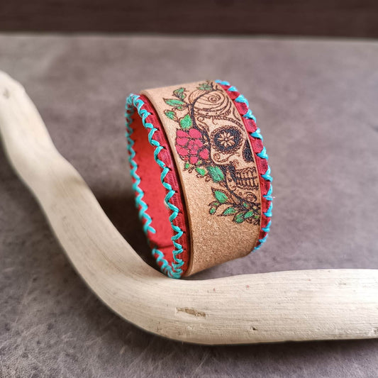 floral sugar skull leather cuff, side-view close up
