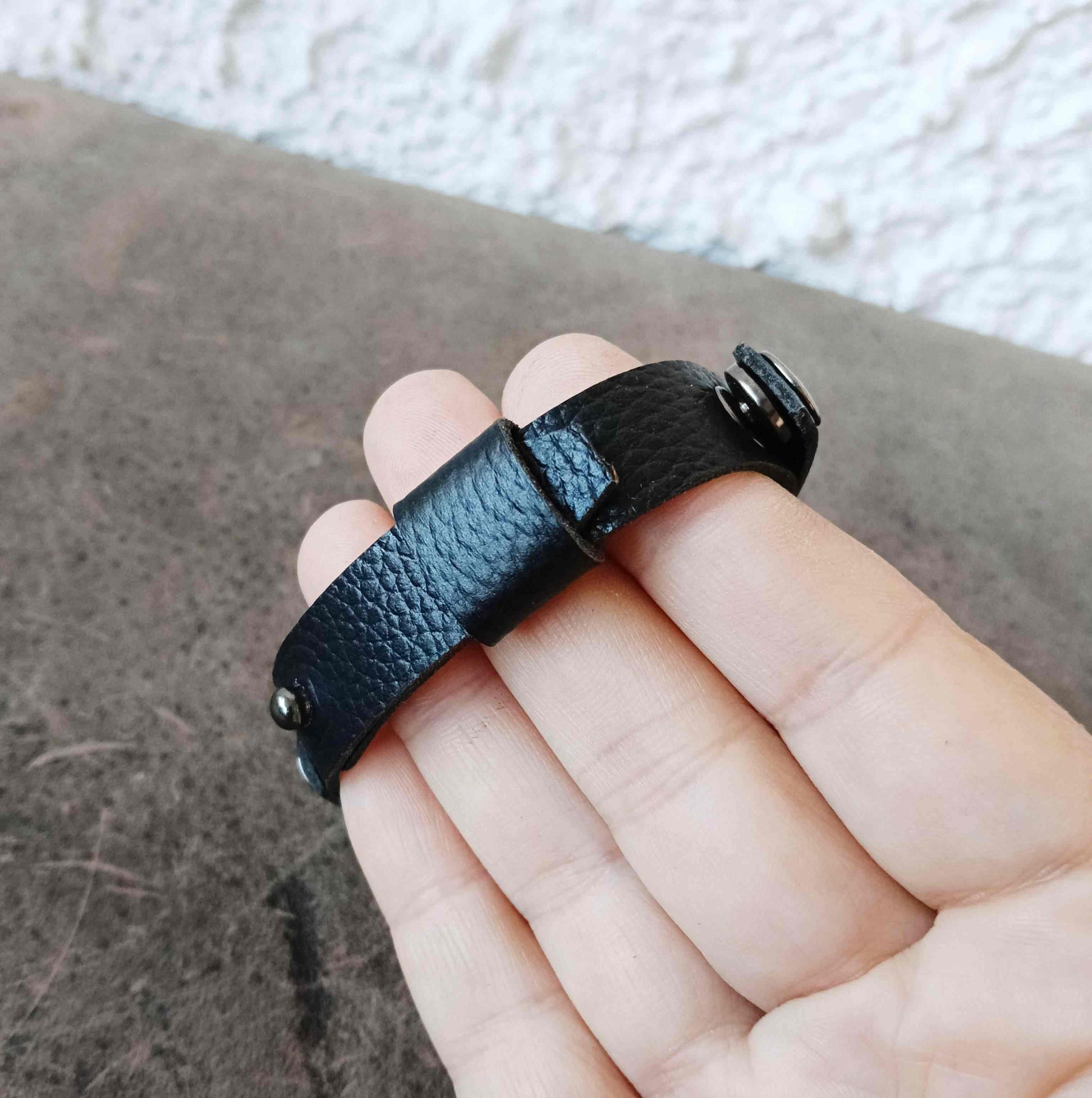 black pebbled leather watchband style ring holder bracelet backside view
